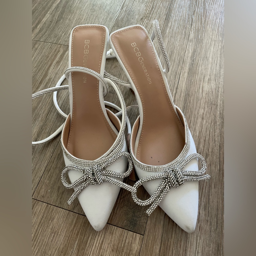 BCBGeneration Cream Heels with Rhinestone Bow